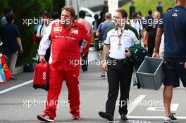 (L to R): Gino Rosato (CDN) Ferrari with Dr. Manfredi Ravetto (ITA) Caterham F1 Team Principal. 04.10.2014. Formula 1 World Championship, Rd 15, Japanese Grand Prix, Suzuka, Japan, Qualifying Day.