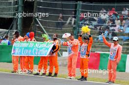 Marshals and fans of Charlie Whiting (GBR) FIA Delegate. 04.10.2014. Formula 1 World Championship, Rd 15, Japanese Grand Prix, Suzuka, Japan, Qualifying Day.