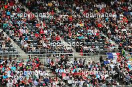Fans in the grandstand. 04.10.2014. Formula 1 World Championship, Rd 15, Japanese Grand Prix, Suzuka, Japan, Qualifying Day.