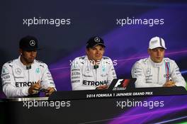 The FIA Press Conference Qualifying top three (L to R): Lewis Hamilton (GBR) Mercedes AMG F1, second; Nico Rosberg (GER) Mercedes AMG F1, pole position; Valtteri Bottas (FIN) Williams, third. 04.10.2014. Formula 1 World Championship, Rd 15, Japanese Grand Prix, Suzuka, Japan, Qualifying Day.