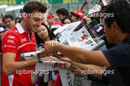 Jules Bianchi (FRA) Marussia F1 Team signs autographs for the fans. 02.10.2014. Formula 1 World Championship, Rd 15, Japanese Grand Prix, Suzuka, Japan, Preparation Day.