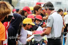 Sam Michael (AUS) McLaren Sporting Director signs autographs for the fans. 02.10.2014. Formula 1 World Championship, Rd 15, Japanese Grand Prix, Suzuka, Japan, Preparation Day.