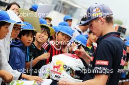 Max Verstappen (NLD) Scuderia Toro Rosso Test Driver signs autographs for the fans. 02.10.2014. Formula 1 World Championship, Rd 15, Japanese Grand Prix, Suzuka, Japan, Preparation Day.