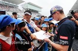 Max Verstappen (NLD) Scuderia Toro Rosso Test Driver signs autographs for the fans. 02.10.2014. Formula 1 World Championship, Rd 15, Japanese Grand Prix, Suzuka, Japan, Preparation Day.