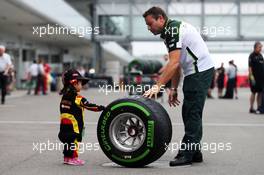 A young fan with a Pirelli tyre. 02.10.2014. Formula 1 World Championship, Rd 15, Japanese Grand Prix, Suzuka, Japan, Preparation Day.