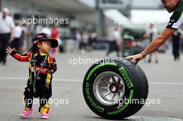 A young fan with a Pirelli tyre. 02.10.2014. Formula 1 World Championship, Rd 15, Japanese Grand Prix, Suzuka, Japan, Preparation Day.