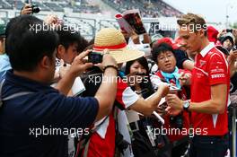 Max Chilton (GBR) Marussia F1 Team signs autographs for the fans. 02.10.2014. Formula 1 World Championship, Rd 15, Japanese Grand Prix, Suzuka, Japan, Preparation Day.