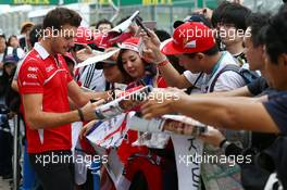 Jules Bianchi (FRA) Marussia F1 Team signs autographs for the fans. 02.10.2014. Formula 1 World Championship, Rd 15, Japanese Grand Prix, Suzuka, Japan, Preparation Day.