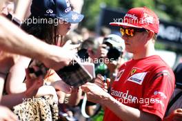 Kimi Raikkonen (FIN) Ferrari signs autographs for the fans. 23.05.2014. Formula 1 World Championship, Rd 6, Monaco Grand Prix, Monte Carlo, Monaco, Friday.