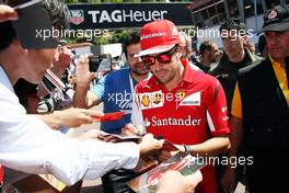 Fernando Alonso (ESP) Ferrari signs autographs for the fans. 23.05.2014. Formula 1 World Championship, Rd 6, Monaco Grand Prix, Monte Carlo, Monaco, Friday.