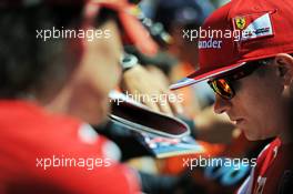 Kimi Raikkonen (FIN) Ferrari signs autographs for the fans. 23.05.2014. Formula 1 World Championship, Rd 6, Monaco Grand Prix, Monte Carlo, Monaco, Friday.