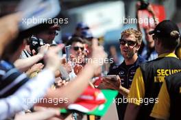 Sebastian Vettel (GER) Red Bull Racing signs autographs for the fans. 23.05.2014. Formula 1 World Championship, Rd 6, Monaco Grand Prix, Monte Carlo, Monaco, Friday.
