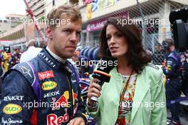 Sebastian Vettel (GER) Red Bull Racing on the grid with Tanja Bauer (GER) Sky Germany TV Presenter. 25.05.2014. Formula 1 World Championship, Rd 6, Monaco Grand Prix, Monte Carlo, Monaco, Race Day.