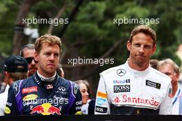 (L to R): Sebastian Vettel (GER) Red Bull Racing and Jenson Button (GBR) McLaren, pay their respects to Sir Jack Brabham (AUS) on the grid. 25.05.2014. Formula 1 World Championship, Rd 6, Monaco Grand Prix, Monte Carlo, Monaco, Race Day.
