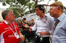 (L to R): Andrei Cheglakov (RUS) Marussia Team Owner on the grid with Toto Wolff (GER) Mercedes AMG F1 Shareholder and Executive Director and Mika Hakkinen (FIN). 25.05.2014. Formula 1 World Championship, Rd 6, Monaco Grand Prix, Monte Carlo, Monaco, Race Day.