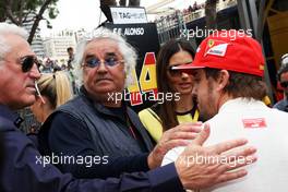 Flavio Briatore (ITA) with wife Elisabetta Gregoraci (ITA) and Fernando Alonso (ESP) Ferrari on the grid. 25.05.2014. Formula 1 World Championship, Rd 6, Monaco Grand Prix, Monte Carlo, Monaco, Race Day.