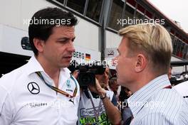 Toto Wolff (GER) Mercedes AMG F1 Shareholder and Executive Director with Mika Hakkinen (FIN). 25.05.2014. Formula 1 World Championship, Rd 6, Monaco Grand Prix, Monte Carlo, Monaco, Race Day.