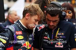 (L to R): Sebastian Vettel (GER) Red Bull Racing with Guillaume Rocquelin (ITA) Red Bull Racing Race Engineer on the grid. 25.05.2014. Formula 1 World Championship, Rd 6, Monaco Grand Prix, Monte Carlo, Monaco, Race Day.
