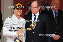 Race winner Nico Rosberg (GER) Mercedes AMG F1 celebrates on the podium with HSH Prince Albert of Monaco (MON). 25.05.2014. Formula 1 World Championship, Rd 6, Monaco Grand Prix, Monte Carlo, Monaco, Race Day.