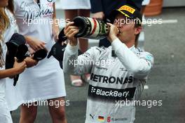 Race winner Nico Rosberg (GER) Mercedes AMG F1 celebrates with the champagne at the podium. 25.05.2014. Formula 1 World Championship, Rd 6, Monaco Grand Prix, Monte Carlo, Monaco, Race Day.