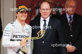 Race winner Nico Rosberg (GER) Mercedes AMG F1 celebrates on the podium with HSH Prince Albert of Monaco (MON). 25.05.2014. Formula 1 World Championship, Rd 6, Monaco Grand Prix, Monte Carlo, Monaco, Race Day.