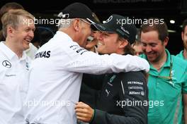 Race winner Nico Rosberg (GER) Mercedes AMG F1 celebrates with Dr. Dieter Zetsche (GER) Daimler AG CEO and the team. 25.05.2014. Formula 1 World Championship, Rd 6, Monaco Grand Prix, Monte Carlo, Monaco, Race Day.