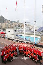 Jules Bianchi (FRA) Marussia F1 Team celebrates his and the team's first F1 points with the team. 25.05.2014. Formula 1 World Championship, Rd 6, Monaco Grand Prix, Monte Carlo, Monaco, Race Day.