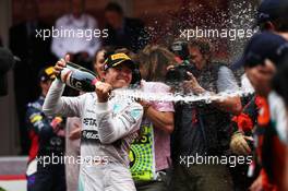 Race winner Lewis Hamilton (GBR) Mercedes AMG F1 celebrates with the champagne at the podium. 25.05.2014. Formula 1 World Championship, Rd 6, Monaco Grand Prix, Monte Carlo, Monaco, Race Day.