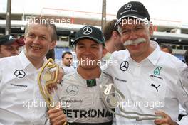 Race winner Nico Rosberg (GER) Mercedes AMG F1 W05 celebrates with Dr. Dieter Zetsche (GER) Daimler AG CEO (Right). 25.05.2014. Formula 1 World Championship, Rd 6, Monaco Grand Prix, Monte Carlo, Monaco, Race Day.