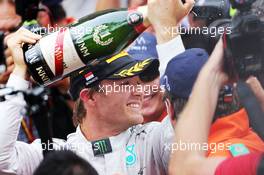 Race winner Lewis Hamilton (GBR) Mercedes AMG F1 celebrates with the champagne on the podium. 25.05.2014. Formula 1 World Championship, Rd 6, Monaco Grand Prix, Monte Carlo, Monaco, Race Day.
