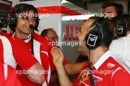 Francesco Nenci (ITA) Marussia F1 Team Race Engineer and the Marussia F1 Team celebrate Jules Bianchi (FRA) scoring their first F1 points. 25.05.2014. Formula 1 World Championship, Rd 6, Monaco Grand Prix, Monte Carlo, Monaco, Race Day.