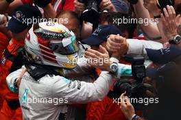 Lewis Hamilton (GBR) Mercedes AMG F1 celebrates his second position with the team in parc ferme. 25.05.2014. Formula 1 World Championship, Rd 6, Monaco Grand Prix, Monte Carlo, Monaco, Race Day.