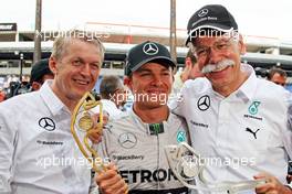 Race winner Nico Rosberg (GER) Mercedes AMG F1 W05 celebrates with Dr. Dieter Zetsche (GER) Daimler AG CEO (Right). 25.05.2014. Formula 1 World Championship, Rd 6, Monaco Grand Prix, Monte Carlo, Monaco, Race Day.