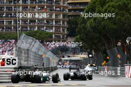 Nico Rosberg (GER) Mercedes AMG F1 W05 leads Lewis Hamilton (GBR) Mercedes AMG F1 W05 behind the FIA Safety Car. 25.05.2014. Formula 1 World Championship, Rd 6, Monaco Grand Prix, Monte Carlo, Monaco, Race Day.