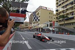 Jules Bianchi (FRA) Marussia F1 Team MR03 takes the chequered flag at the end of the race to score the team's first F1 points. 25.05.2014. Formula 1 World Championship, Rd 6, Monaco Grand Prix, Monte Carlo, Monaco, Race Day.