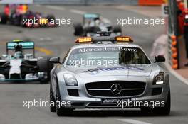 Nico Rosberg (GER) Mercedes AMG F1 W05 leads behind the FIA Safety Car. 25.05.2014. Formula 1 World Championship, Rd 6, Monaco Grand Prix, Monte Carlo, Monaco, Race Day.