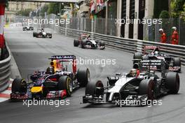 (L to R): Sebastian Vettel (GER) Red Bull Racing RB10 and Kevin Magnussen (DEN) McLaren MP4-29 battle for position. 25.05.2014. Formula 1 World Championship, Rd 6, Monaco Grand Prix, Monte Carlo, Monaco, Race Day.