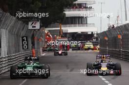 (L to R): Kamui Kobayashi (JPN) Caterham CT05 and Sebastian Vettel (GER) Red Bull Racing RB10. 25.05.2014. Formula 1 World Championship, Rd 6, Monaco Grand Prix, Monte Carlo, Monaco, Race Day.