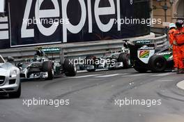 Nico Rosberg (GER) Mercedes AMG F1 W05 and Lewis Hamilton (GBR) Mercedes AMG F1 W05 pass the Sahara Force India F1 VJM07 of Sergio Perez (MEX) Sahara Force India F1. 25.05.2014. Formula 1 World Championship, Rd 6, Monaco Grand Prix, Monte Carlo, Monaco, Race Day.