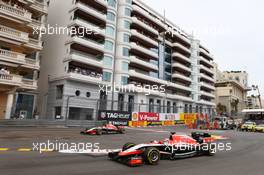 Jules Bianchi (FRA) Marussia F1 Team MR03 and team mate Max Chilton (GBR) Marussia F1 Team MR03, who runs wide. 25.05.2014. Formula 1 World Championship, Rd 6, Monaco Grand Prix, Monte Carlo, Monaco, Race Day.