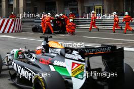 Nico Hulkenberg (GER) Sahara Force India F1 VJM07 passes the crashed Sauber C33 of Adrian Sutil (GER) Sauber. 25.05.2014. Formula 1 World Championship, Rd 6, Monaco Grand Prix, Monte Carlo, Monaco, Race Day.