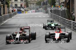 (L to R): Romain Grosjean (FRA) Lotus F1 E22 and Max Chilton (GBR) Marussia F1 Team MR03 battle for position. 25.05.2014. Formula 1 World Championship, Rd 6, Monaco Grand Prix, Monte Carlo, Monaco, Race Day.