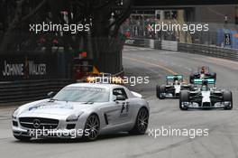 Nico Rosberg (GER) Mercedes AMG F1 W05 leads behind the FIA Safety Car. 25.05.2014. Formula 1 World Championship, Rd 6, Monaco Grand Prix, Monte Carlo, Monaco, Race Day.