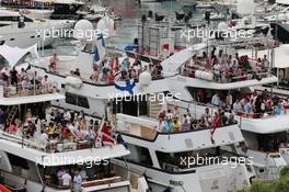 Fans on boats in the scenic Monaco Harbour. 25.05.2014. Formula 1 World Championship, Rd 6, Monaco Grand Prix, Monte Carlo, Monaco, Race Day.