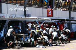 Nico Rosberg (GER) Mercedes AMG F1 W05 and Lewis Hamilton (GBR) Mercedes AMG F1 W05 in the pits. 24.05.2014. Formula 1 World Championship, Rd 6, Monaco Grand Prix, Monte Carlo, Monaco, Qualifying Day