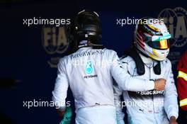 (L to R): pole sitter Nico Rosberg (GER) Mercedes AMG F1 with team mate Lewis Hamilton (GBR) Mercedes AMG F1 in parc ferme. 24.05.2014. Formula 1 World Championship, Rd 6, Monaco Grand Prix, Monte Carlo, Monaco, Qualifying Day