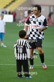 Felipe Massa (BRA) Williams with his son Felipinho (BRA), at the charity football match. 20.05.2014. Formula 1 World Championship, Rd 6, Monaco Grand Prix, Monte Carlo, Monaco, Tuesday Soccer.