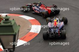 Daniil Kvyat (RUS) Scuderia Toro Rosso STR9 leads Daniel Ricciardo (AUS) Red Bull Racing RB10. 22.05.2014. Formula 1 World Championship, Rd 6, Monaco Grand Prix, Monte Carlo, Monaco, Practice Day.