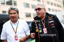 (L to R): Pasquale Lattuneddu (ITA) of the FOM with Dr. Vijay Mallya (IND) Sahara Force India F1 Team Owner. 22.05.2014. Formula 1 World Championship, Rd 6, Monaco Grand Prix, Monte Carlo, Monaco, Practice Day.