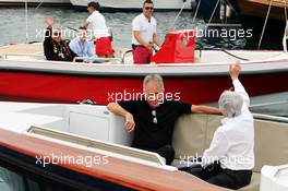 Bernie Ecclestone (GBR) greets Dr. Vijay Mallya (IND) Sahara Force India F1 Team Owner as he arrives by boat to the paddock. 22.05.2014. Formula 1 World Championship, Rd 6, Monaco Grand Prix, Monte Carlo, Monaco, Practice Day.